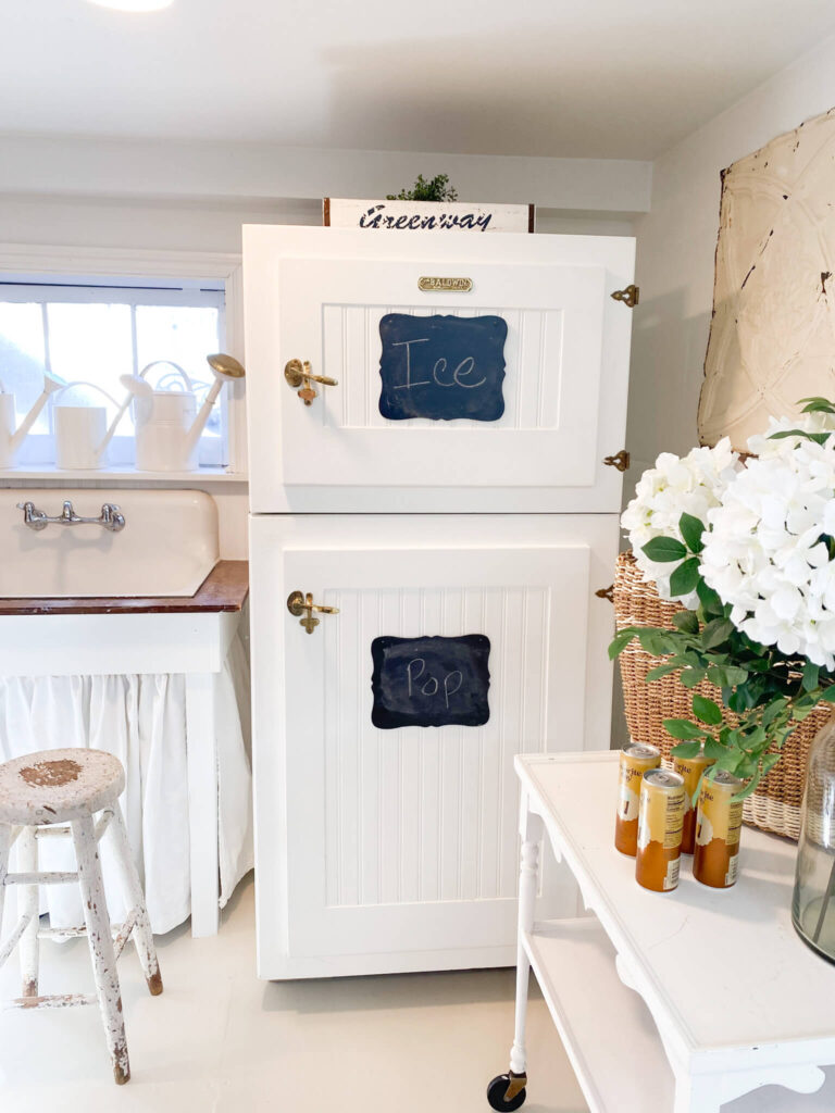 Retro refrigerator with bead board panels and vintage inspired ice box hardware