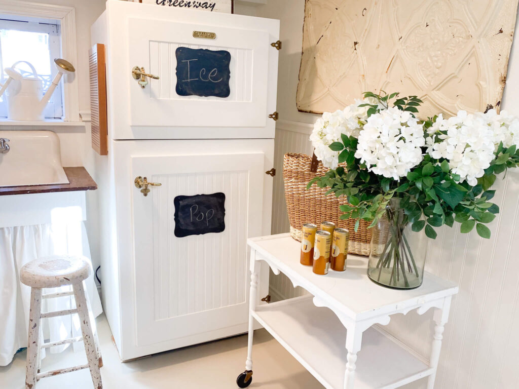 Vintage inspired refrigerator with antique serving cart