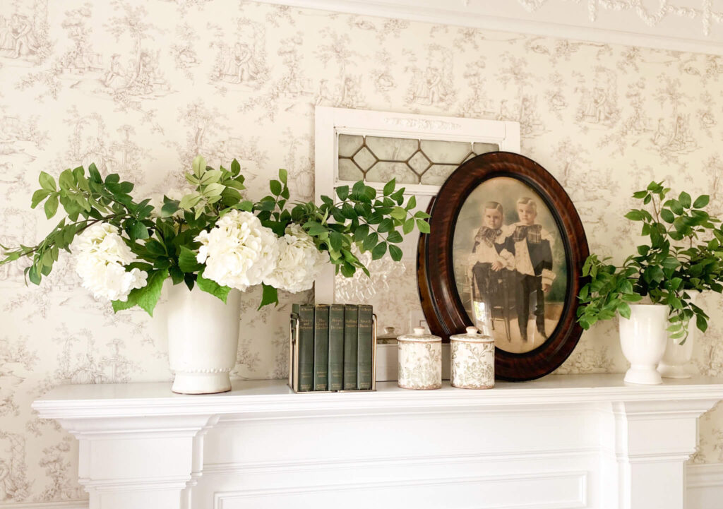 How to style a mantel tips with spring florals, vintage finds using colors white, brown and green