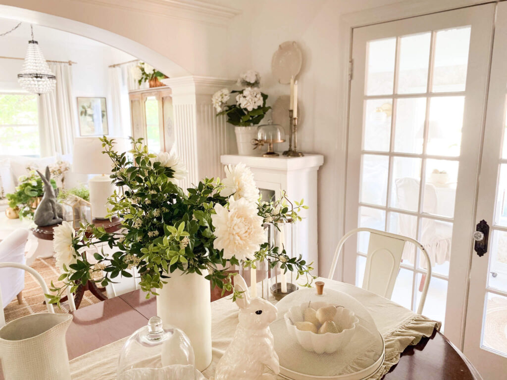 Vintage dining room featuring white dishes new and collected with spring florals