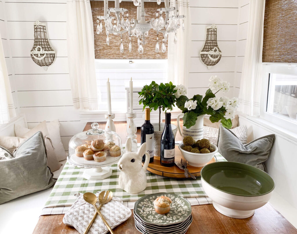 Cottage kitchen nook refresh with white geranium flowers, vintage style dishes and a gingham table cloth