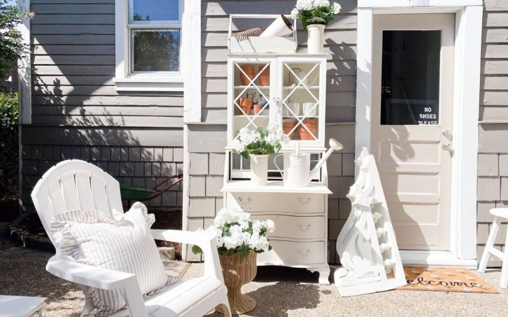 DIY potting bench with DIY florals and vintage corbels.