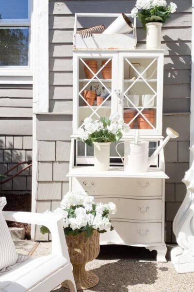 DIY potting bench with DIY florals and vintage corbels.