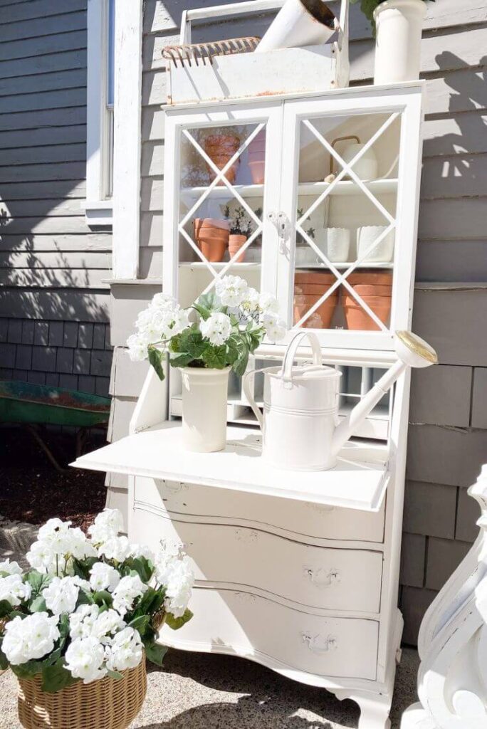 DIY potting table from an old vintage desk to style an outdoor patio space.