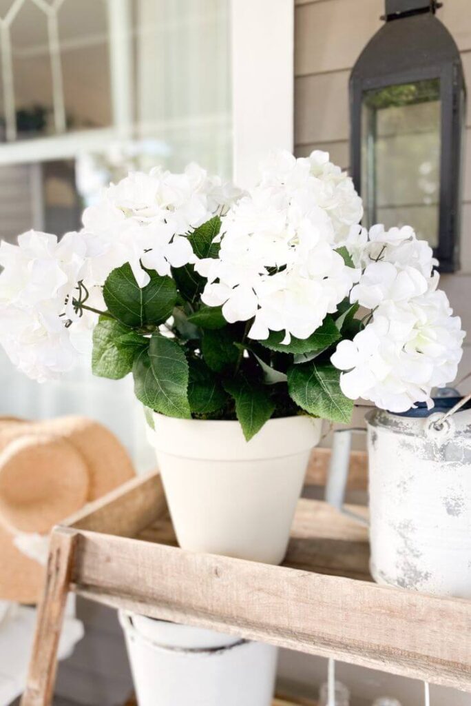 Large DIY Flower Pot with white hydrageas for decorating a small front porch