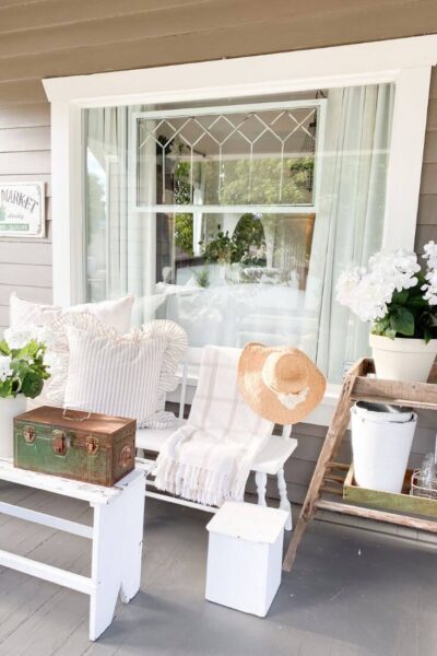 Summer porch with white hydragea faux florals.