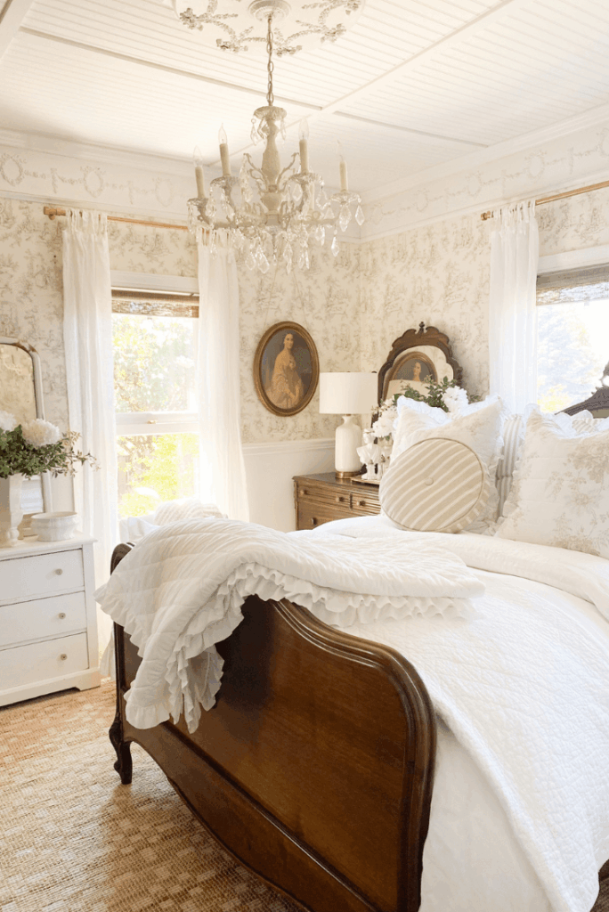 Cottage bedroom refresh with ruffled quilt bedding, striped pillows, and light summer layers