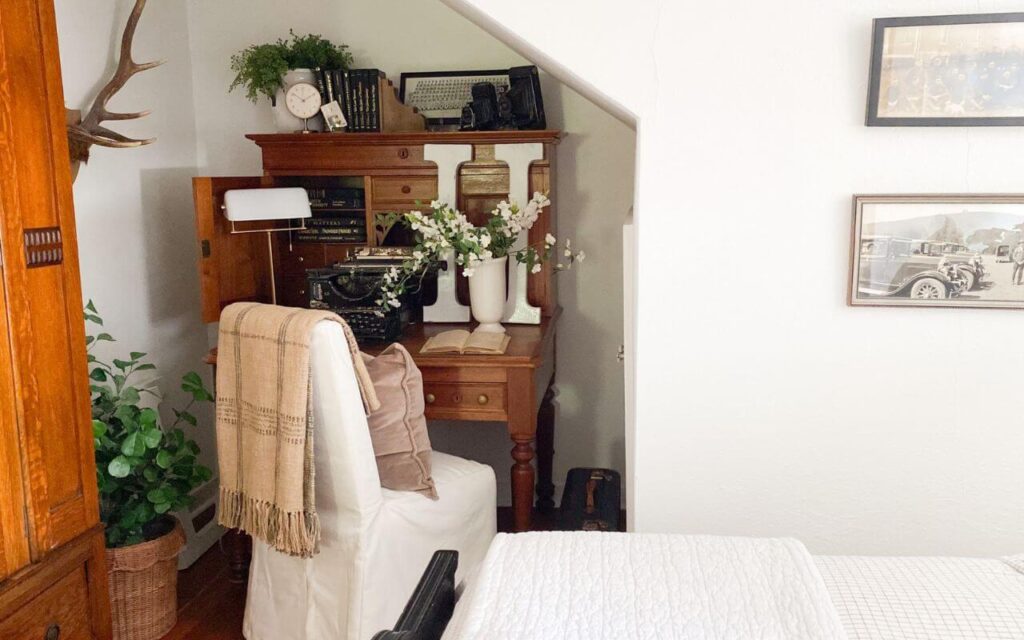 Small guest bedroom featuring cottage-style furniture