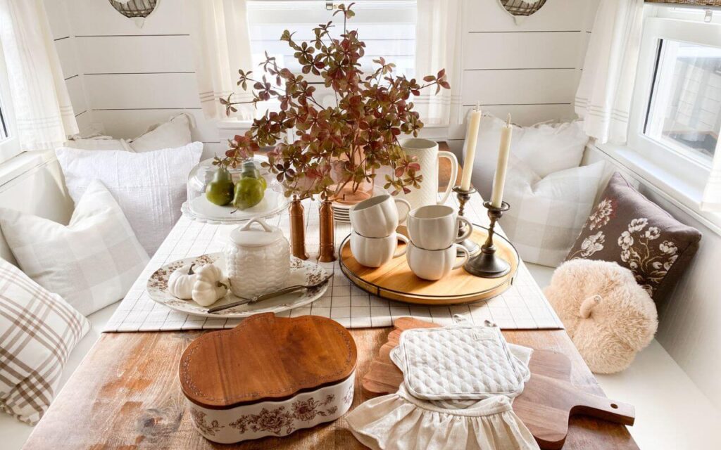 Vintage candelabras and fall stems on a cozy cottage kitchen table