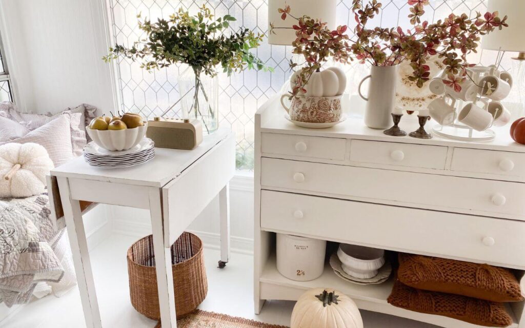 Fall cozy layers with cozy pumpkin pillows, fall stems and brown and white transferware