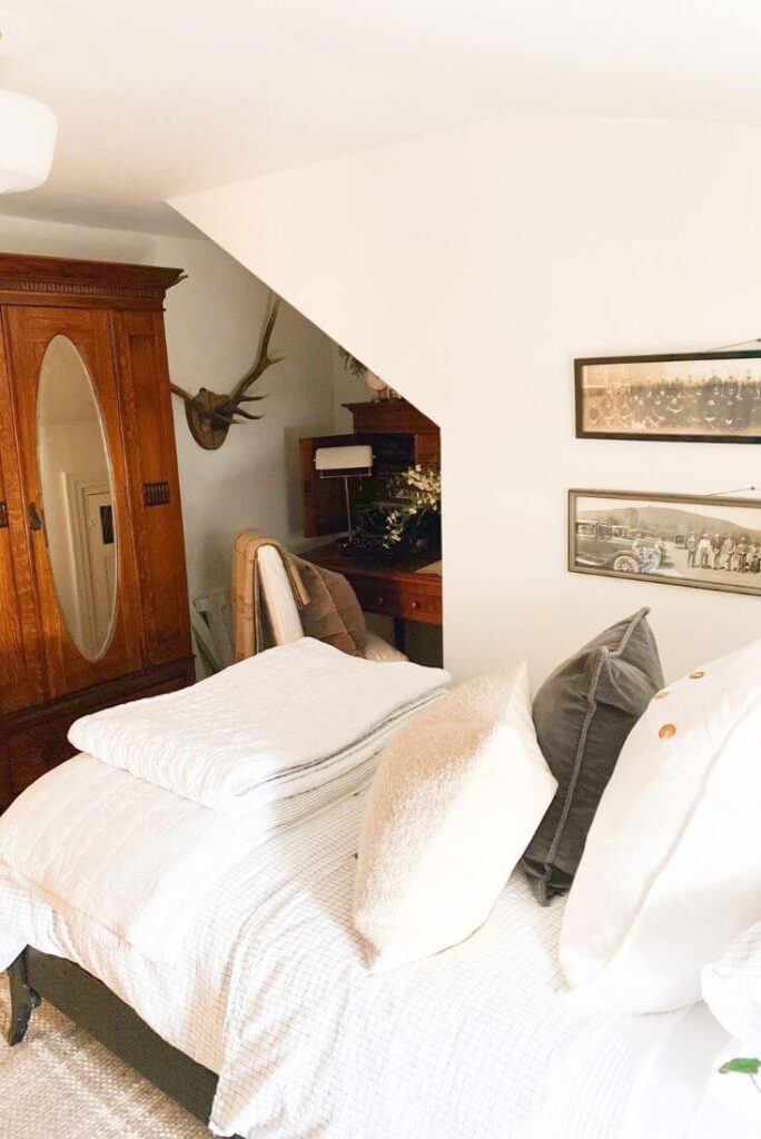 Small guest bedroom featuring cottage-style furniture