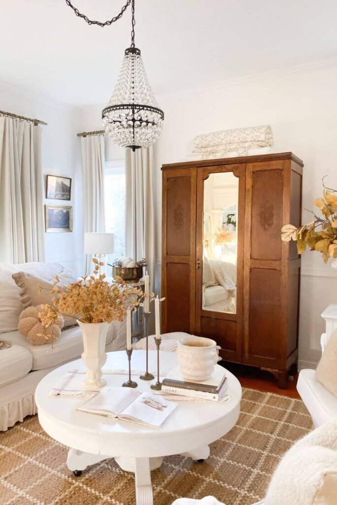 Warm fall living room with vintage details, soft candlelight, and neutral color palette