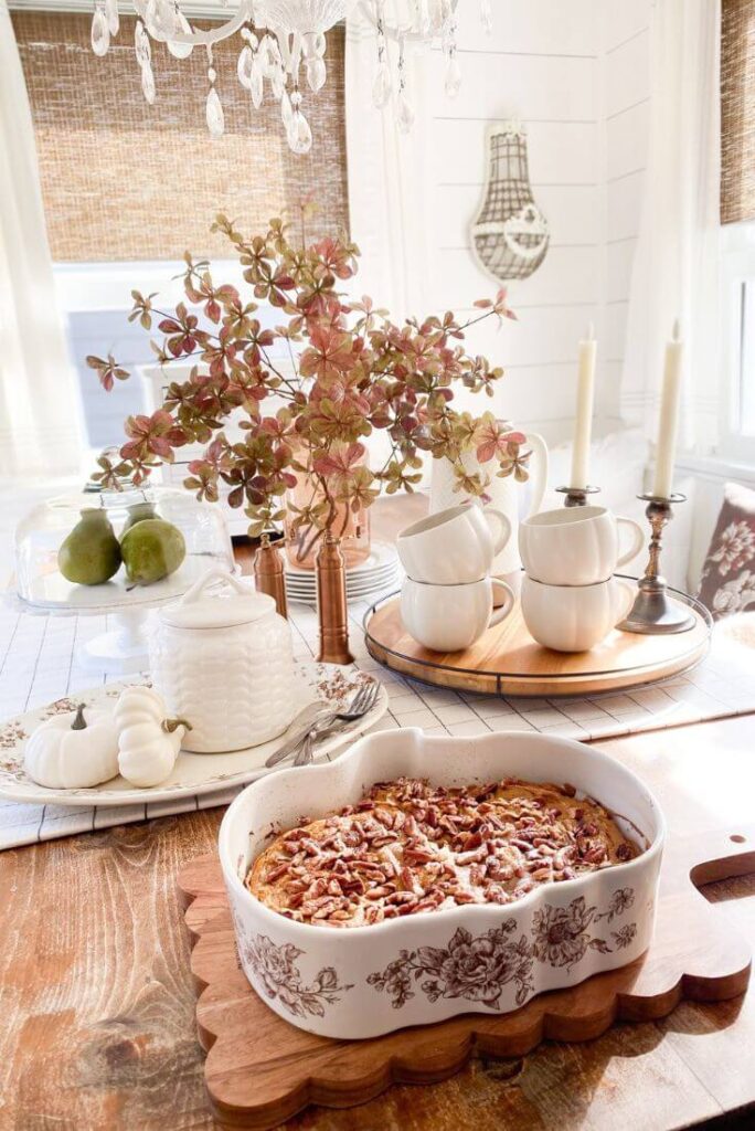 Fall tablescape with pumpkin dessert in brown and white floral pumpkin baking dish