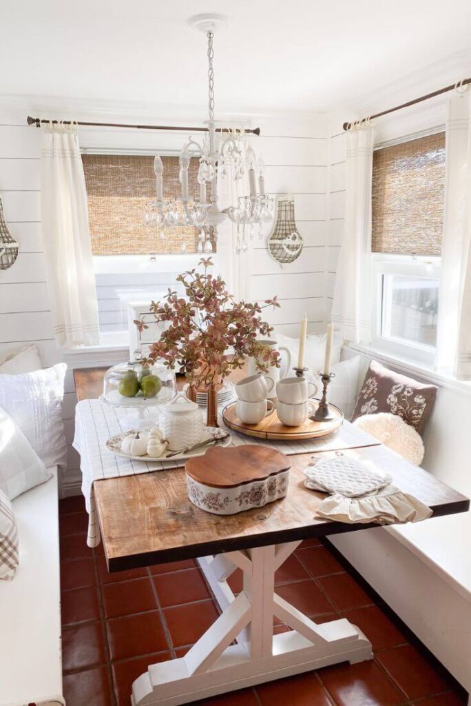 Cozy fall kitchen nook tablescape with seasonal fall decor.