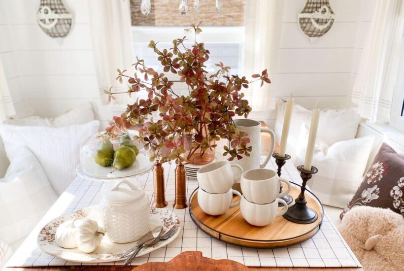 Fall table styled with brown and white transferware and pumpkin mugs