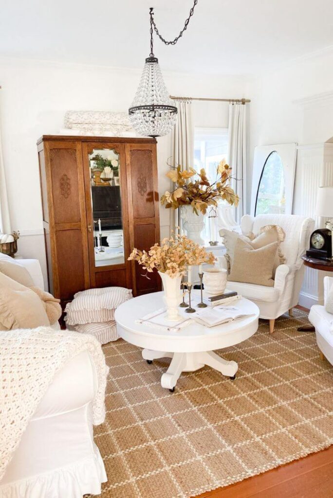 Small cottage living room with soft lighting and subtle autumn textures.