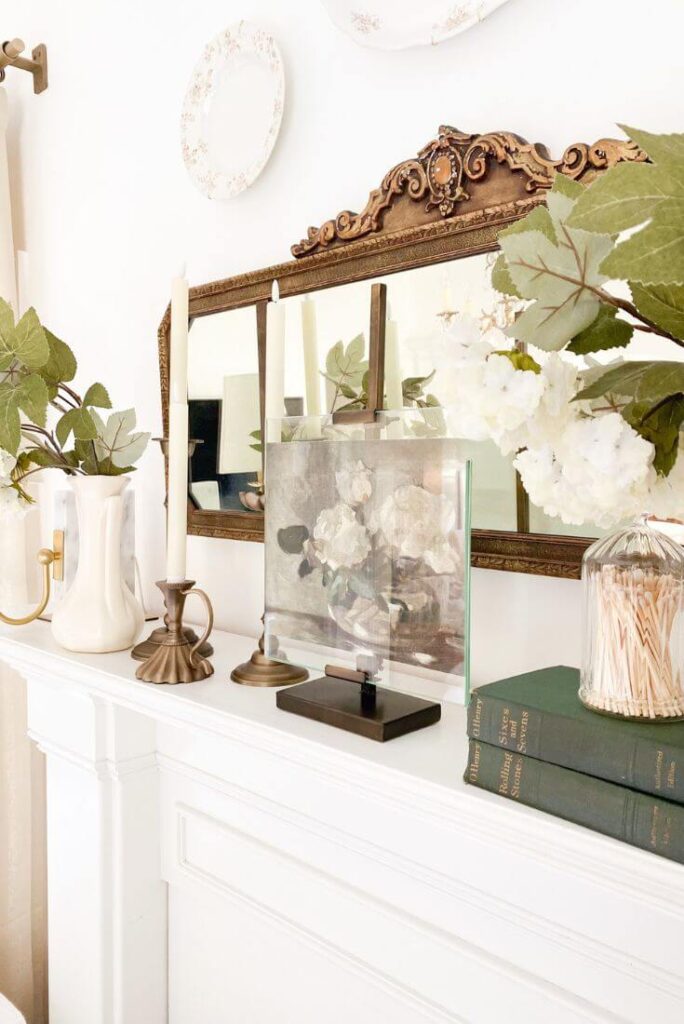 Side angle of mantel highlighting layered vintage textures and warm brass tones