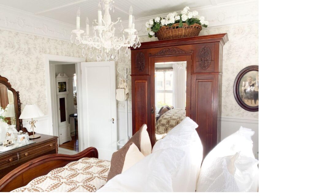 Small cottage bedroom styled with neutral winter tones.