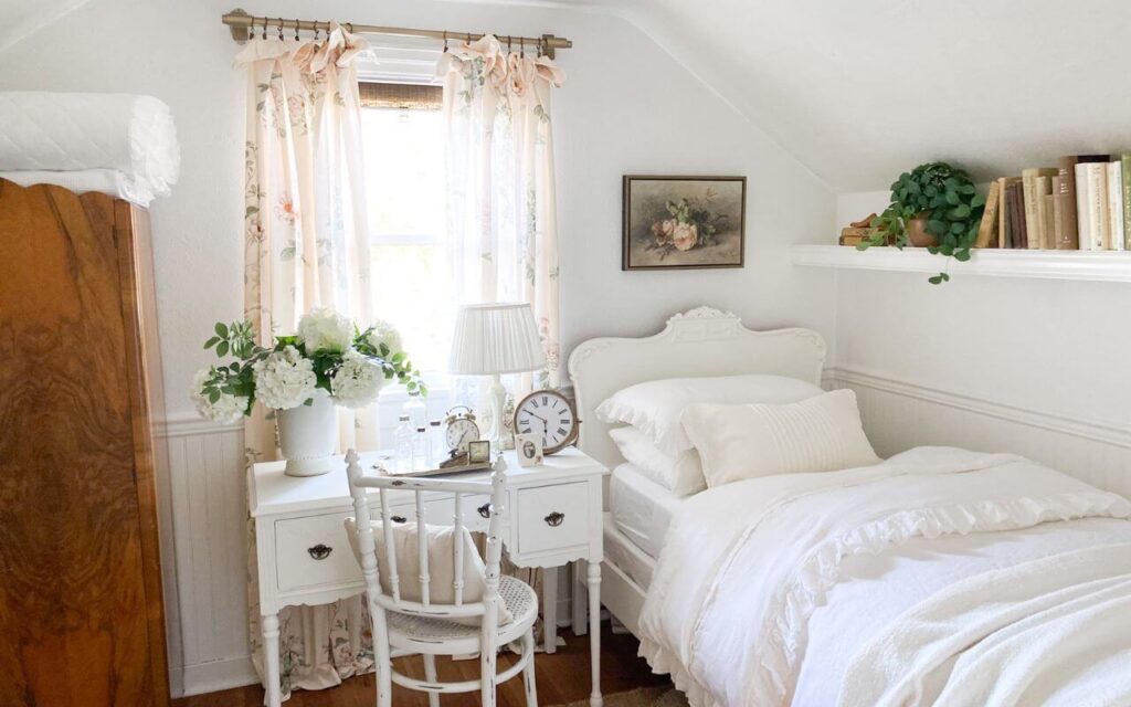 White ruffled duvet in a cottage bedroom refresh with pink floral curtain panels
