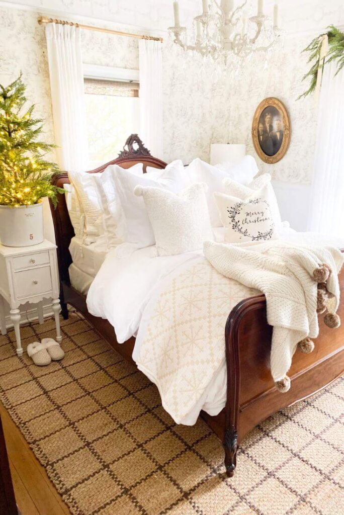 Christmas bedroom with grid-pattern jute rug and cozy layered bedding.