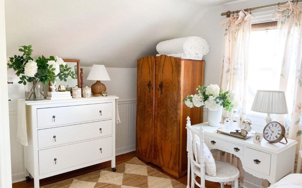 Antique armoire in a neutral cottage bedroom