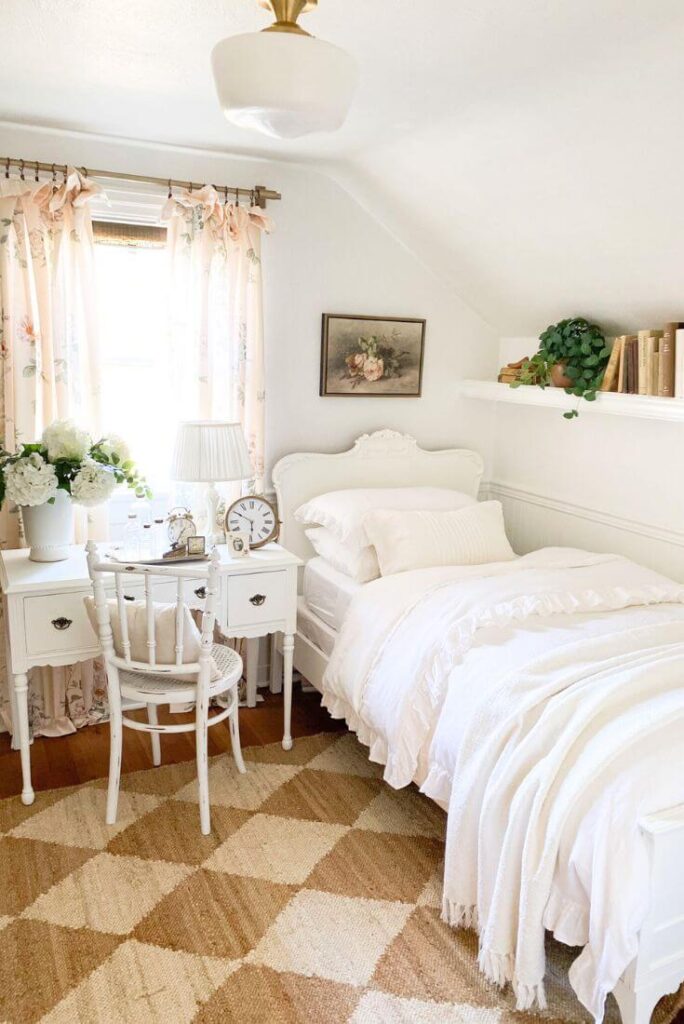 Cottage guest room corner showing floral curtains and vintage touches