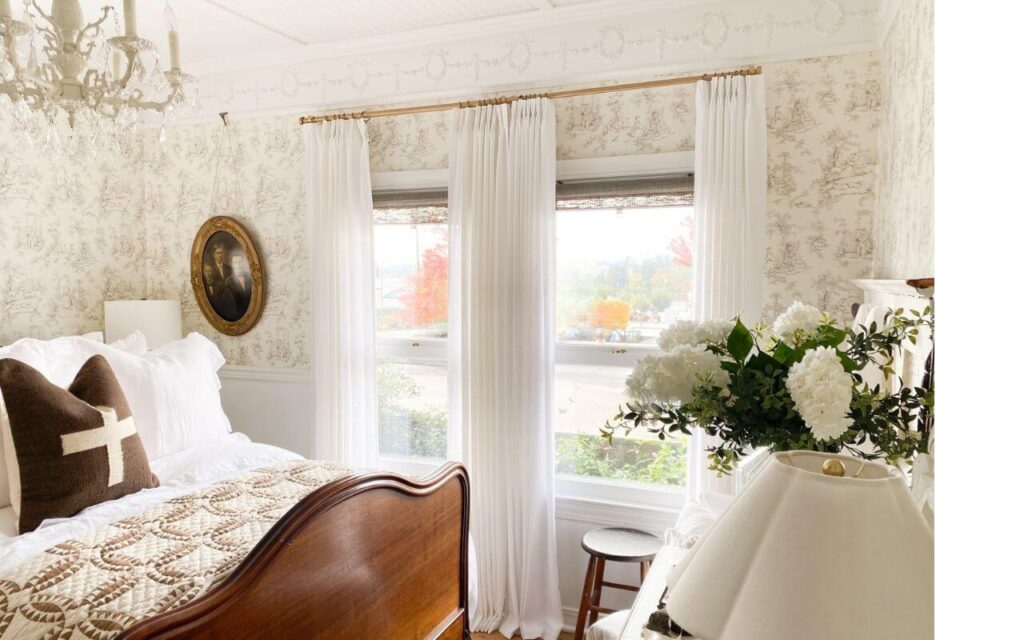 Pleated linen-style curtains filtering soft natural light.