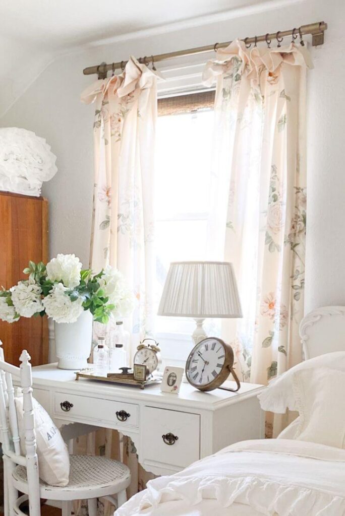 Two pink floral curtain panels close up