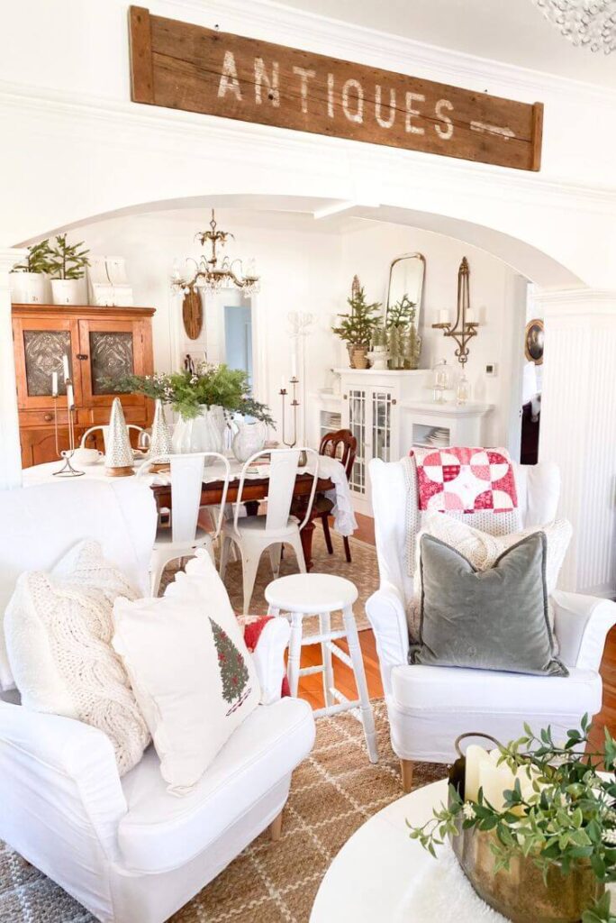 White, red and green decor at Christmas time in a cottage living room.