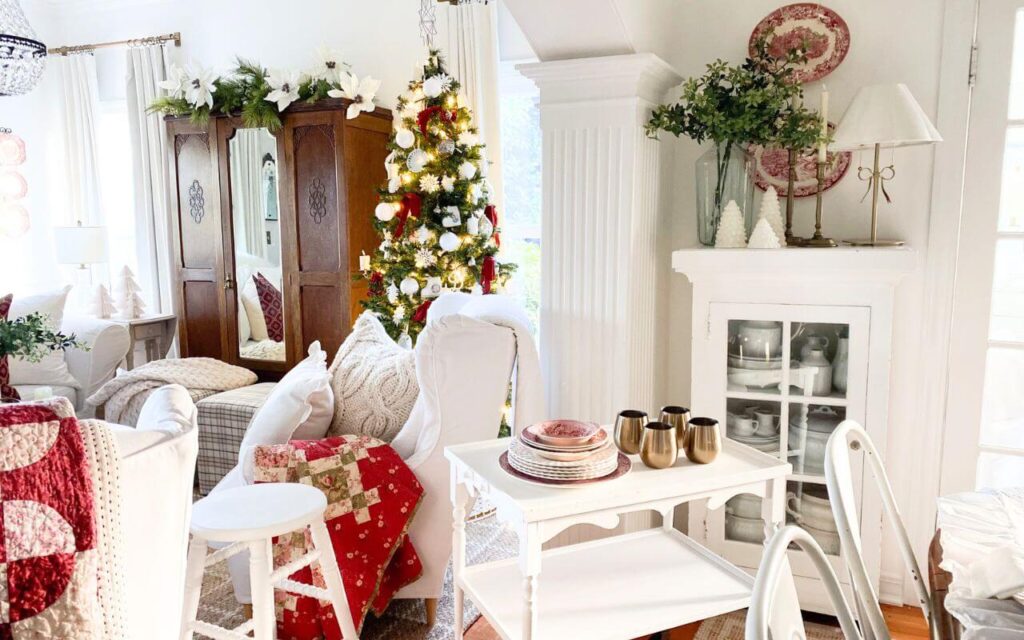 Cozy Christmas living room with a neutral color palette, subtle red accents, and cottage-style furnishings