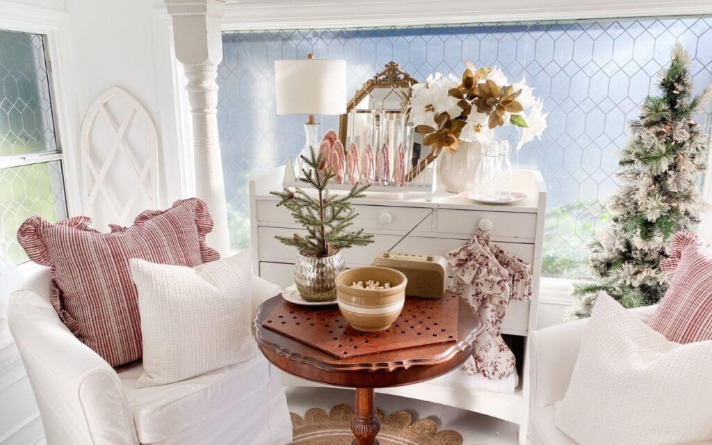 Cozy Christmas cottage ruffled pillows with floral toile stockings in a vintage sunroom