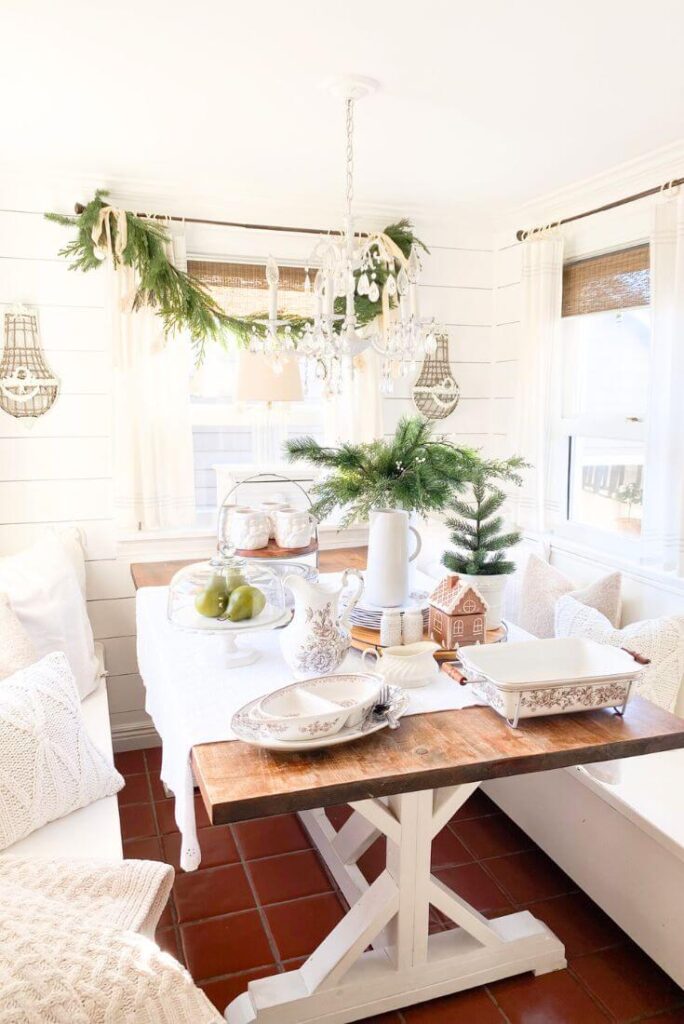Cozy Christmas kitchen nook with Santa mugs and brown transferware plates.