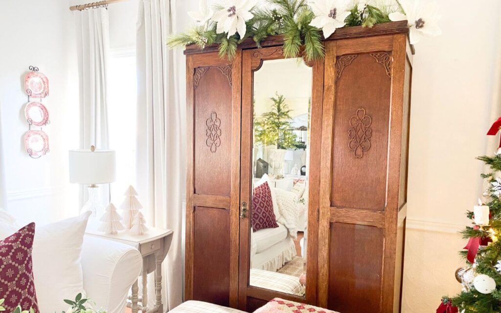 Antique furniture and red accents for a vintage style Christmas living room