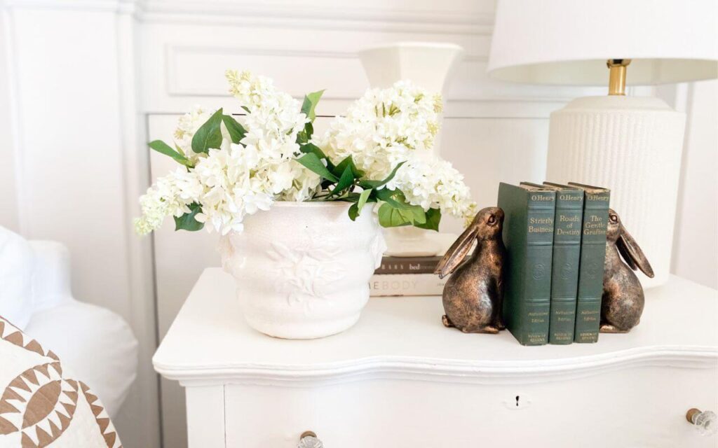 Close up of faux white lilacs used for a quick pre-spring living room refresh