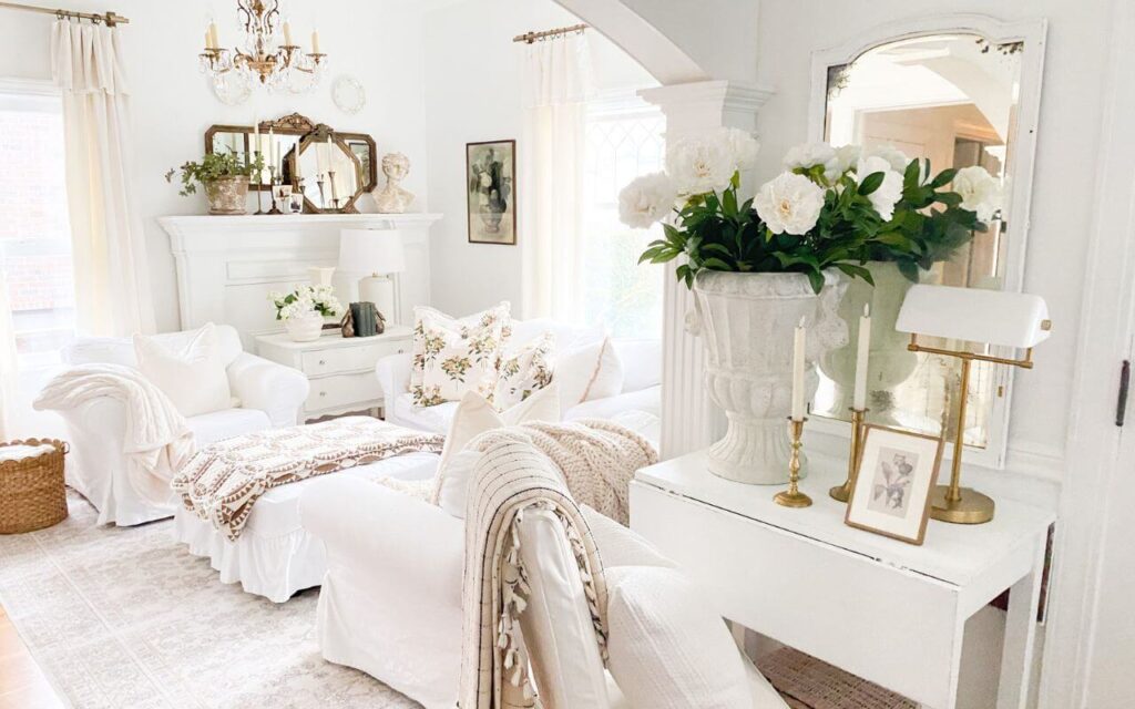 Pre-spring living room decor with layered quilts, floral pillows, and cozy winter textures after Christmas