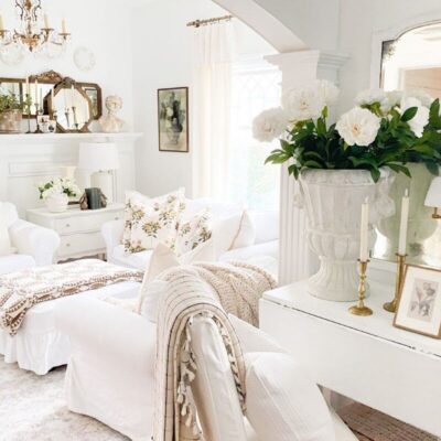 Pre-spring living room decor with layered quilts, floral pillows, and cozy winter textures after Christmas