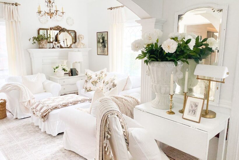 Pre-spring living room decor with layered quilts, floral pillows, and cozy winter textures after Christmas