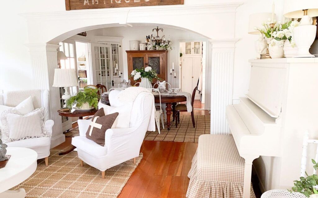 Cottage living room with painted antique piano and ruffled gingham bench