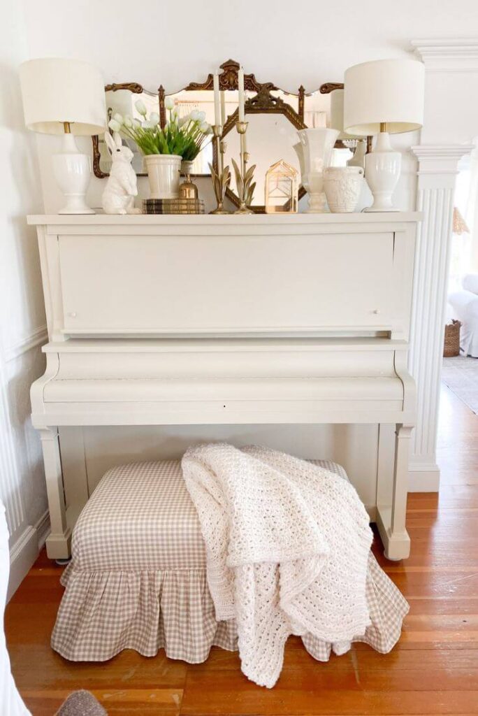 Antique piano makeover with Fusion Mineral paint and ruffled gingham bench and styled with brass antique finds.