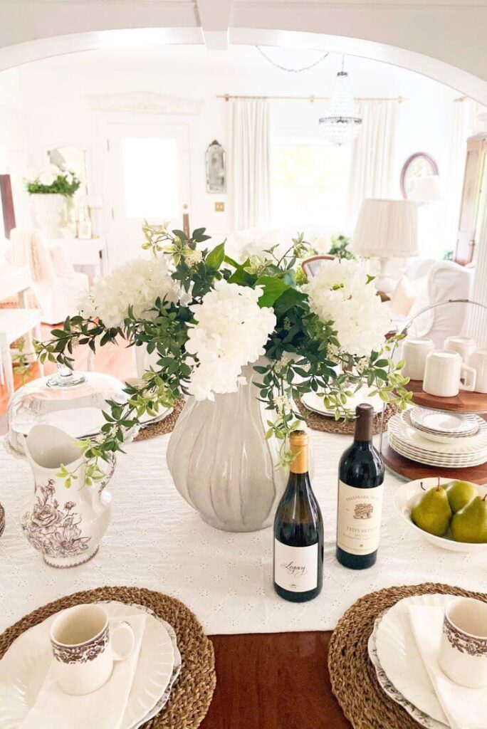 Faux flowers arranged on cottage dining table from Amazon.