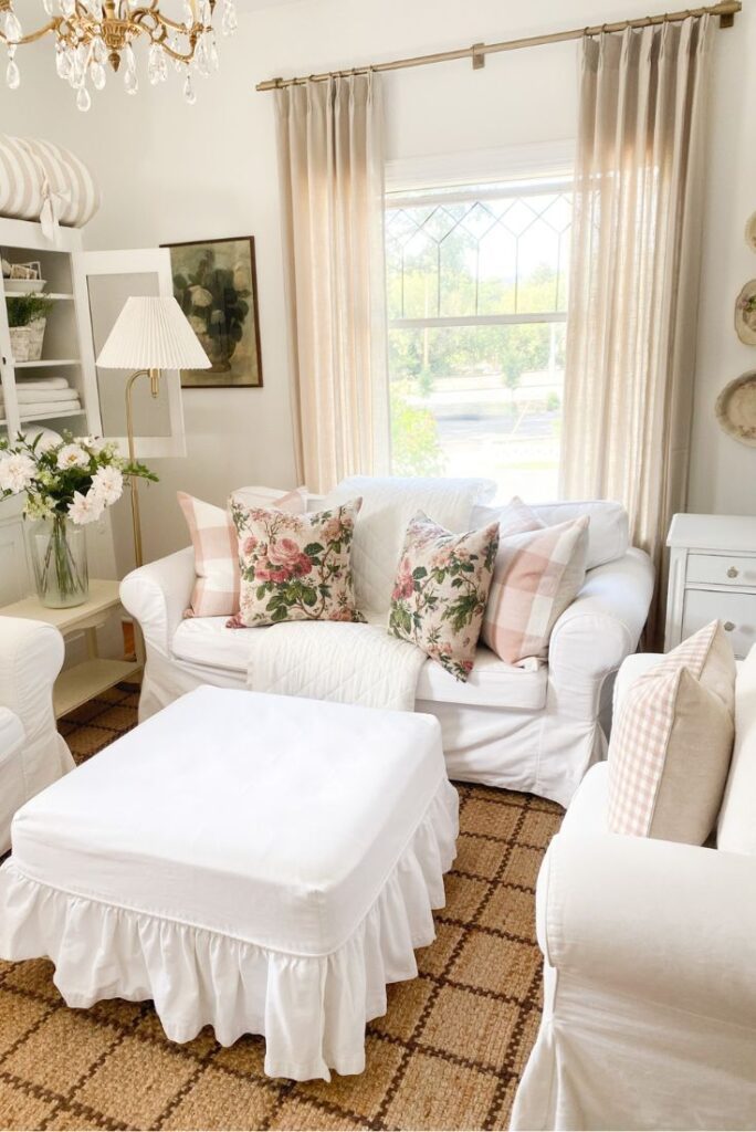 White ruffled slipcovered furniture with pink gingham and pink buffalo check pillows